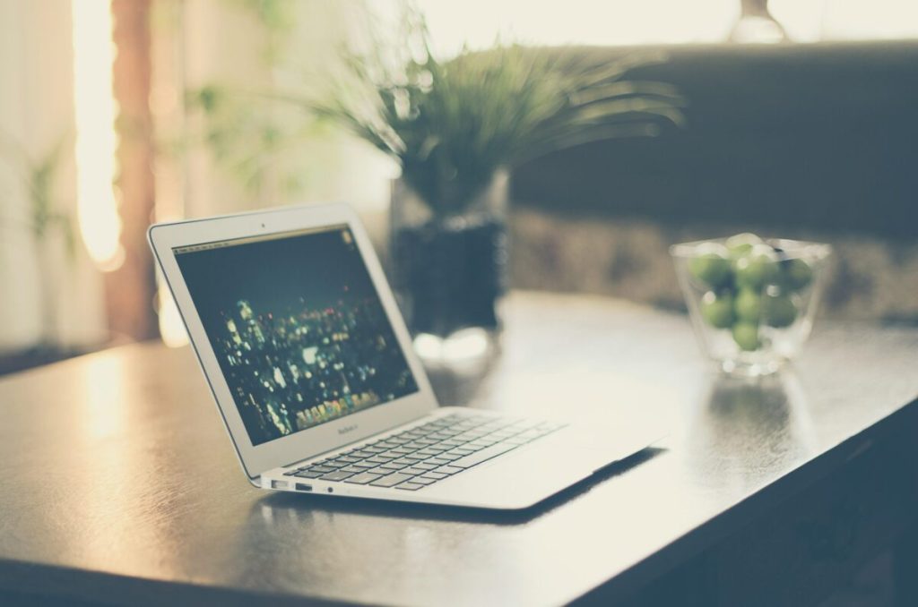 Computer on desk with plants